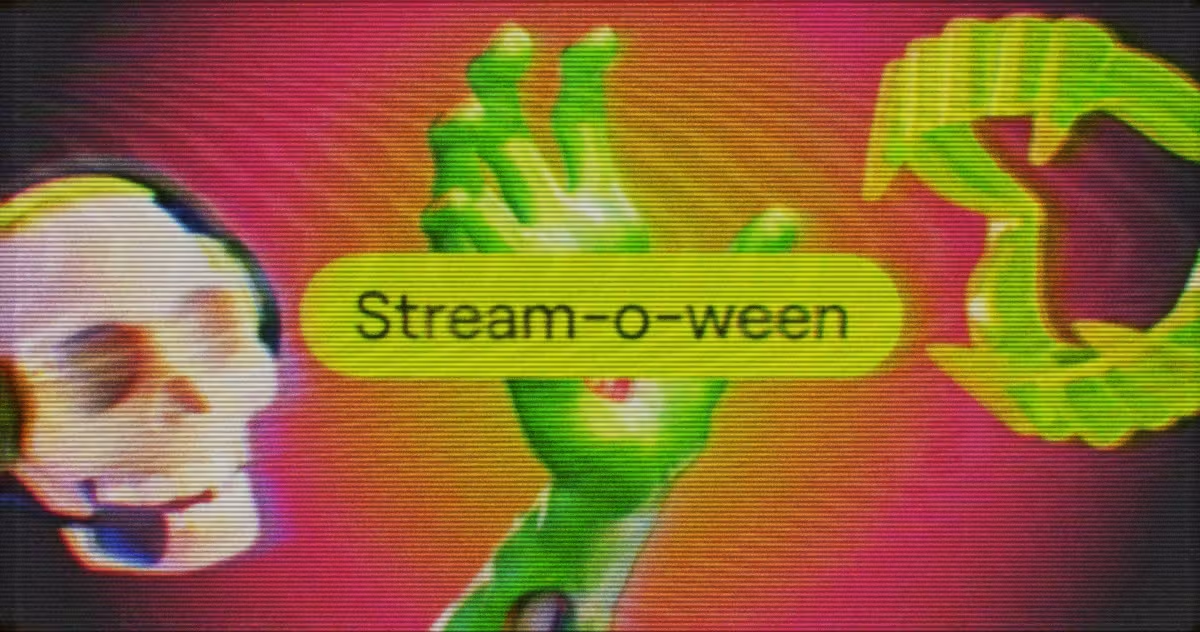 Un teschio al neon e mani di zombie verdi circondano un'etichetta gialla Stream-o-ween su uno sfondo rosa-arancione.