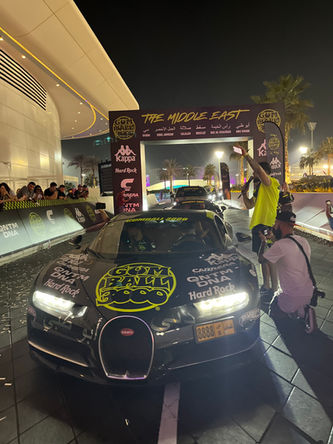 Mr. JWW, arriving in his Bugatti at the finish line in Abu Dhabi, Gumball 3000