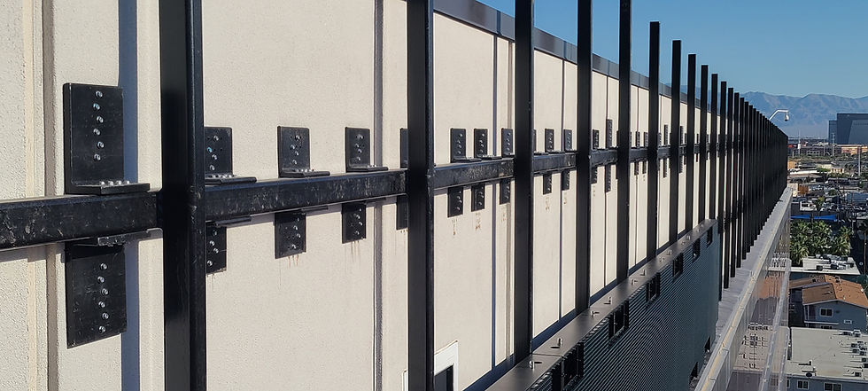 Angled view of black metal facade panels on a modern building
