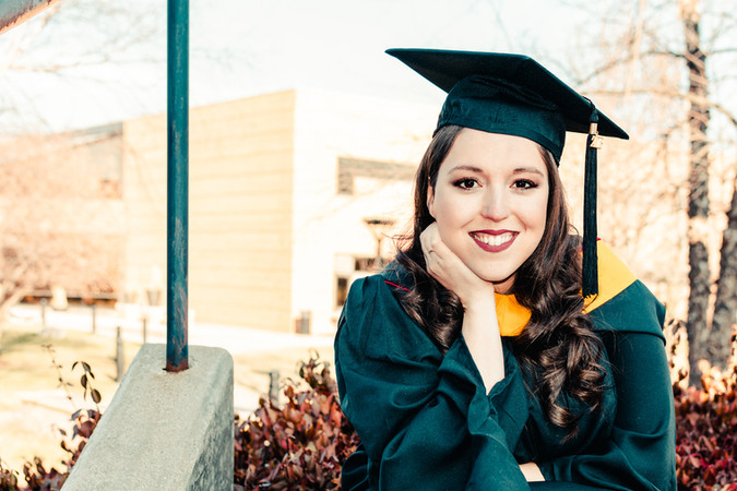 A Saginaw Valley State University graduate in her cap and gown