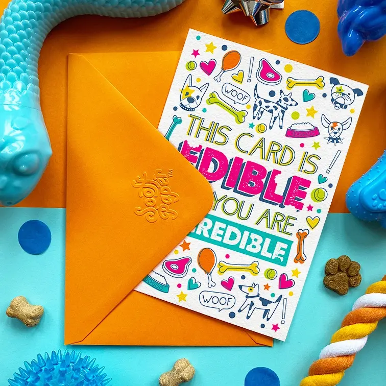 Thumbnail: Scoff Paper Edible & Incredible hondenkaart met oranje envelop en hondenspeeltjes