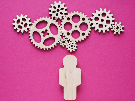 Person with gears above head concepts of executive functioning, cognitive overload, cognitive efficiency, executive leadership