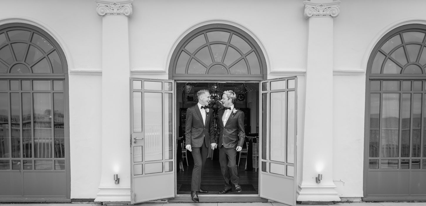 Smartly dressed guests stepping out onto the balcony at the Dome