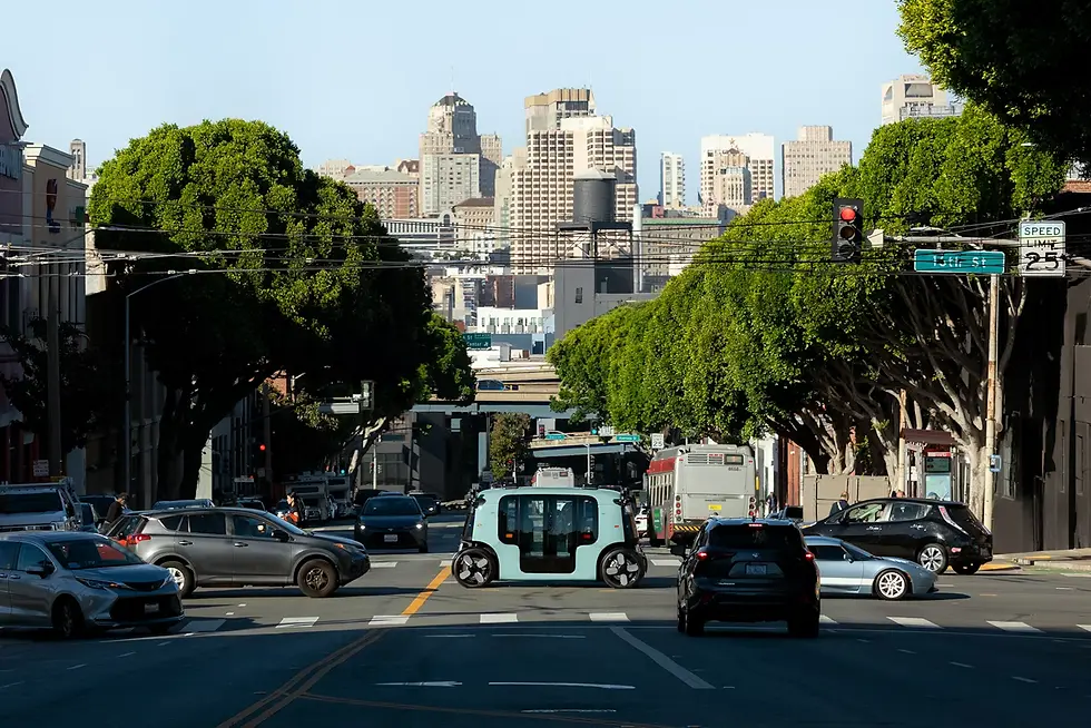 Zoox, Inc. “Zoox Robotaxi Crossing a San Francisco Intersection.” Zoox Journal, 2025, https://www.datocms-assets.com/134289/1734466392-1731091143-zoox-robotaxi-crosses-intersection-in-san-francisco.avif?auto=compress&dpr=2&fm=webp&q=90&w=1440.