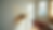 Eye-level view of a homeowner painting a living room wall with a roller brush