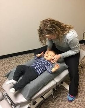 Dr. Racheal adjusting a pediatric patient