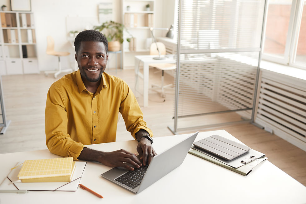 smiling-african-american-man-at-desk-in-office-2023-11-27-04-53-00-utc.jpg