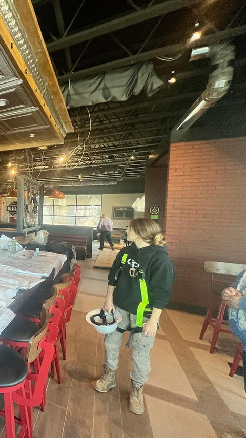 Cowboy Painting Co. painting the interior of a restaurant in Middletown, Delaware, with durable, high-quality finishes to create a fresh and inviting dining atmosphere