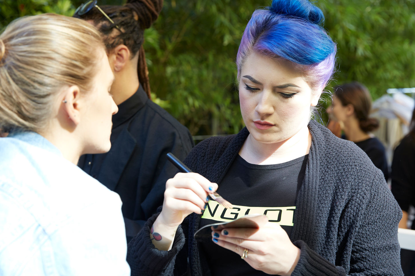 Makeup artist applying cosmetics