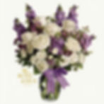 Elegant white roses and purple flowers in vase