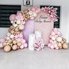 Baby Shower with pink and gold balloon arch, celebration themes