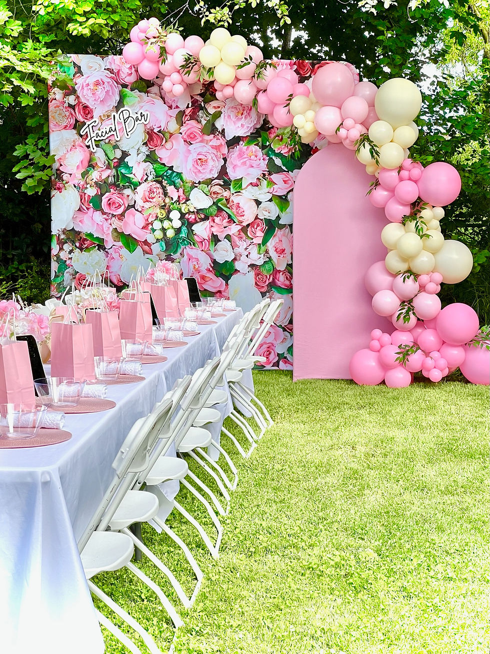 Garden party with floral backdrop and custom balloon decorations