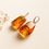 Thumbnail: Rectangle shape cognac colors amber earrings with skin