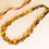 Thumbnail: Green and cognac colors natural amber rectangle shape beads necklace