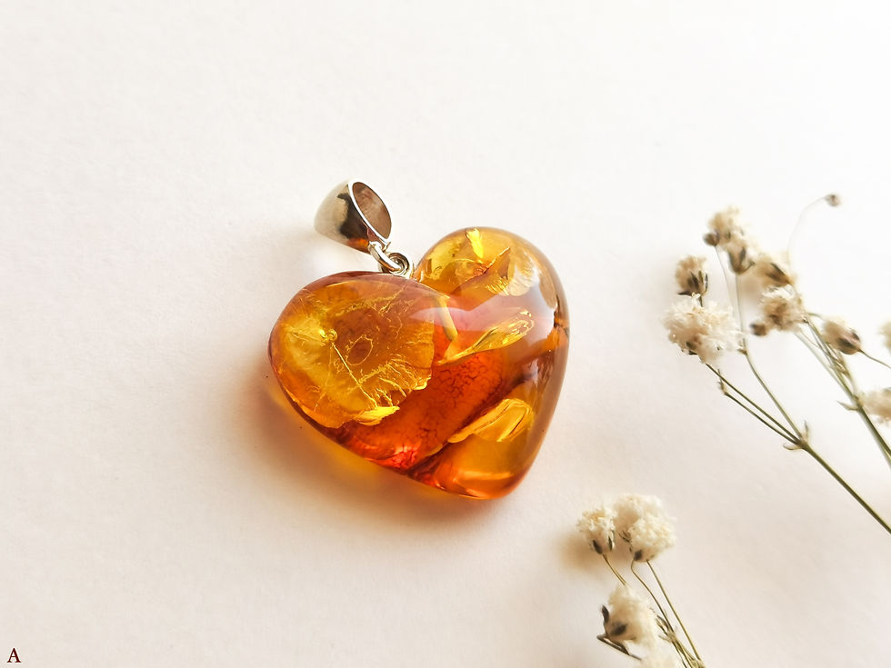 Small light cognac color natural amber heart pendant