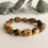 Thumbnail: Genuine Baltic Amber oval beads gray and black colors bracelet