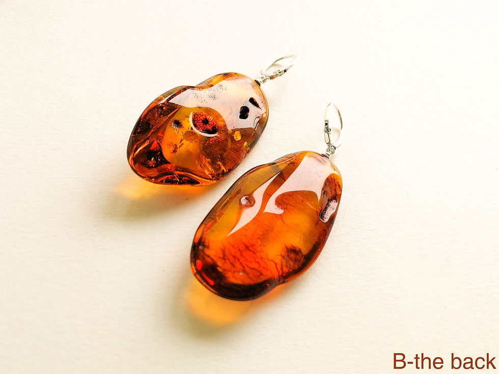 Thumbnail: Intense cognac color  unique oval shape genuine amber earrings