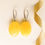 Thumbnail: Medium size matt yellow oval shape amber earrings