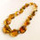 Thumbnail: Natural Colombian copal light cognac color large natural shape necklace
