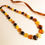 Thumbnail: Multicolor natural amber medium size flat round beads necklace