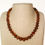 Thumbnail: Bright and intense cognac color natural amber nuggets necklace