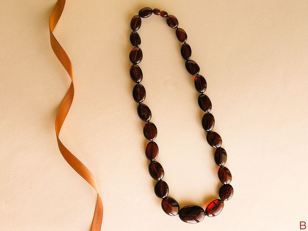 Thumbnail: Dark cherry color natural amber oval beads necklace