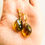 Thumbnail: Green amber twisted pendant and earrings jewelry set with silver gold plated