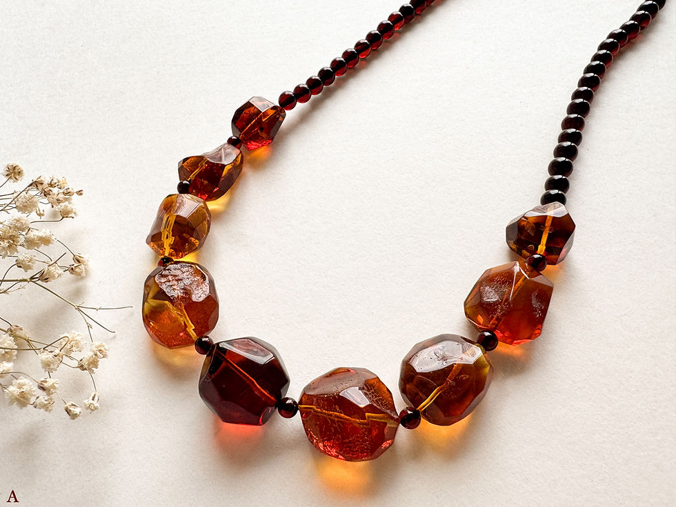 Thumbnail: Faceted cognac and red amber necklace with cherry round beads