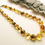 Thumbnail: Handmade Amber Necklace - Light & Dark Green Faceted Coin Beads