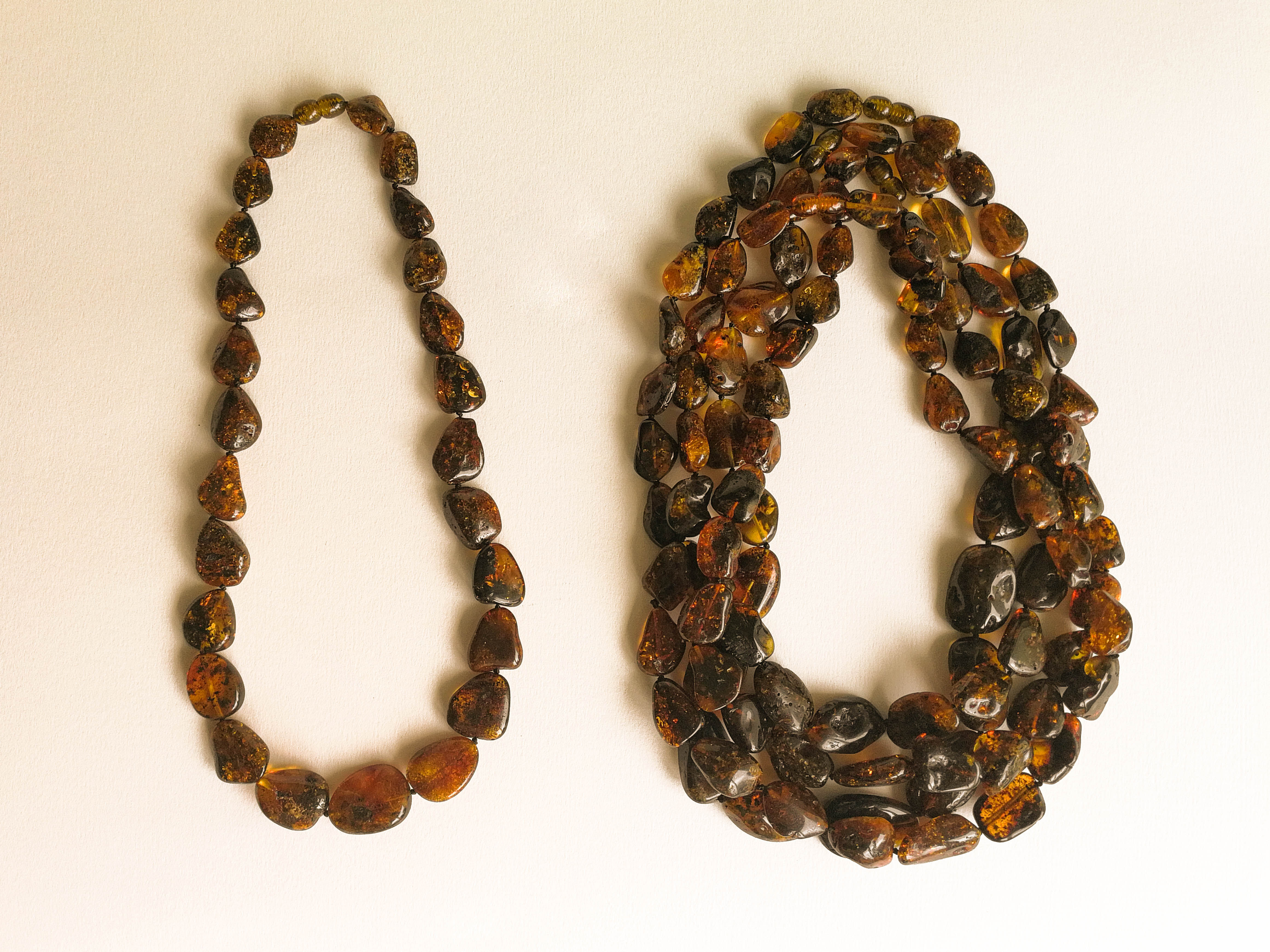 A set of 5 Dark green and brown colors natural amber necklaces