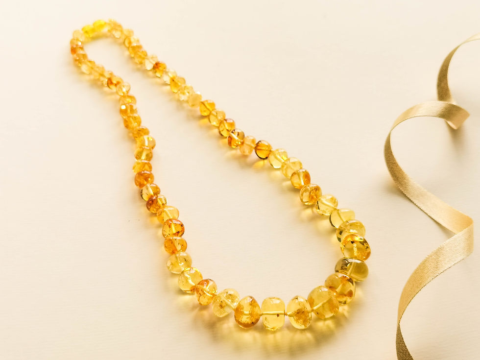 Thumbnail: Very light lemon color genuine amber medium baroque necklace