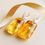 Thumbnail: Light cognac rectangle shape amber earrings