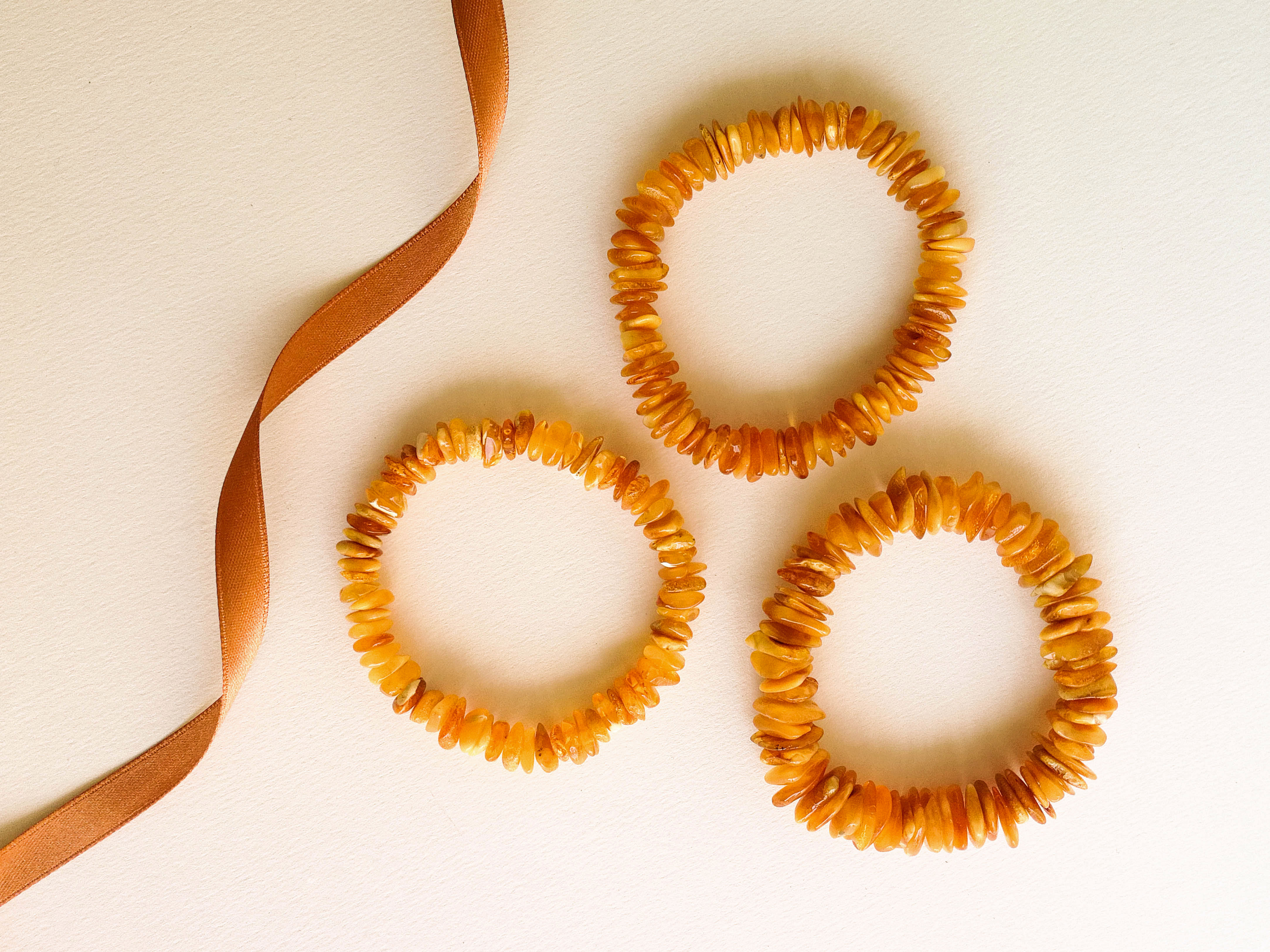 A set of 3 caramel orange color chips natural amber bracelets