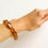 Thumbnail: Large cognac color rectangle beads elastic statement bracelet