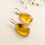 Thumbnail: Very small oval shape natural amber lemon color earrings with insects