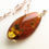 Thumbnail: Very large dark cognac color natural amber rhombus pendant