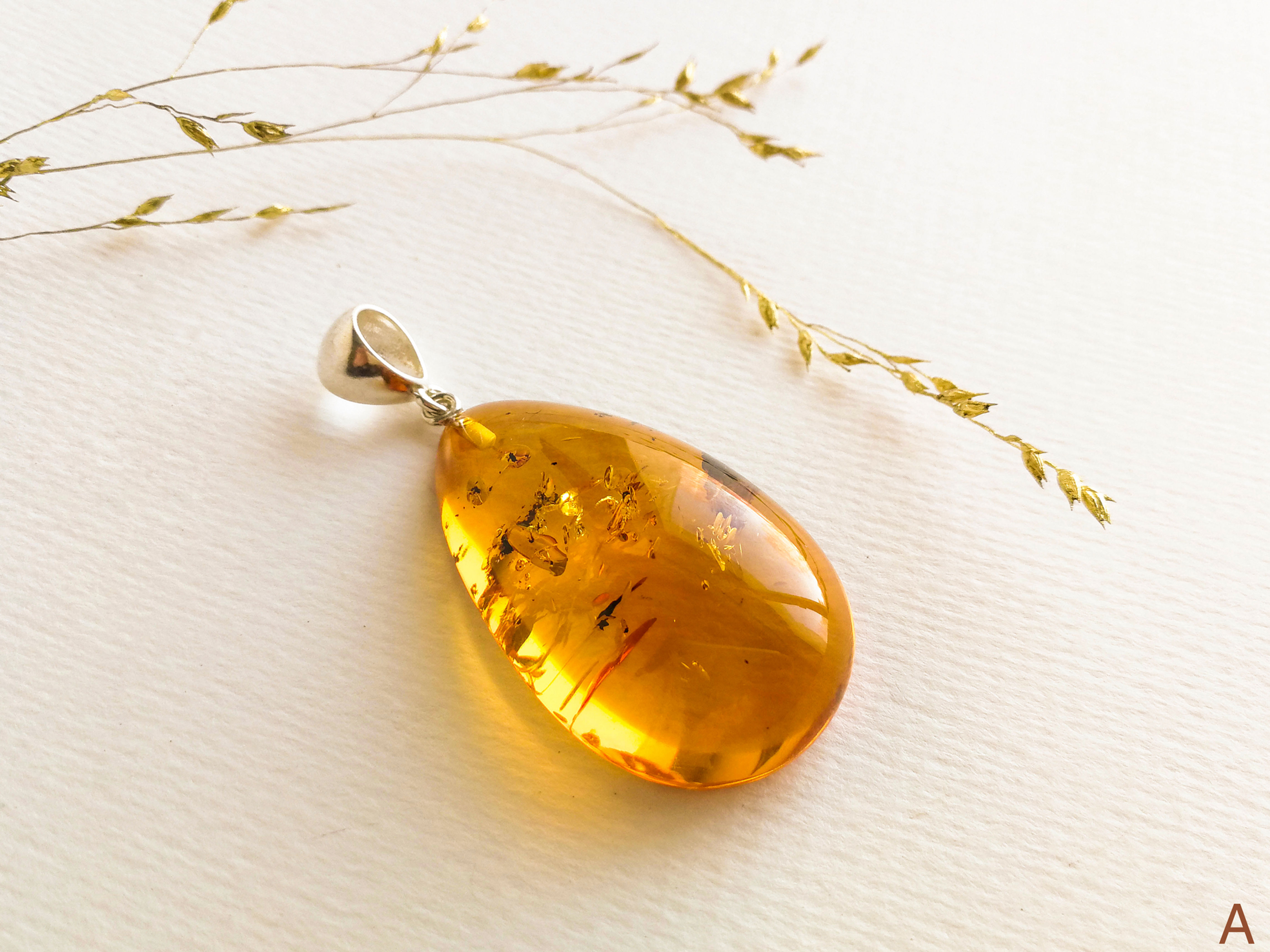 Shiny cognac small drop shape genuine amber pendant