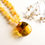 Thumbnail: Clear lemon natural amber pendant with insects on round matt yellow necklace