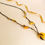 Thumbnail: Matt yellow natural amber large donut long necklace
