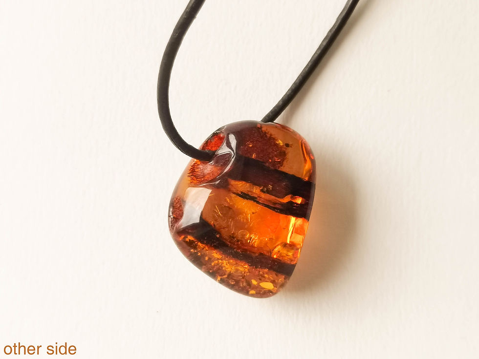 Thumbnail: Shiny cognac color amber pendant with natural hole on genuine leather strand