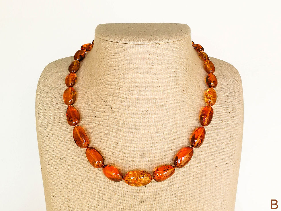 Thumbnail: Shiny cognac color oval beads amber necklace