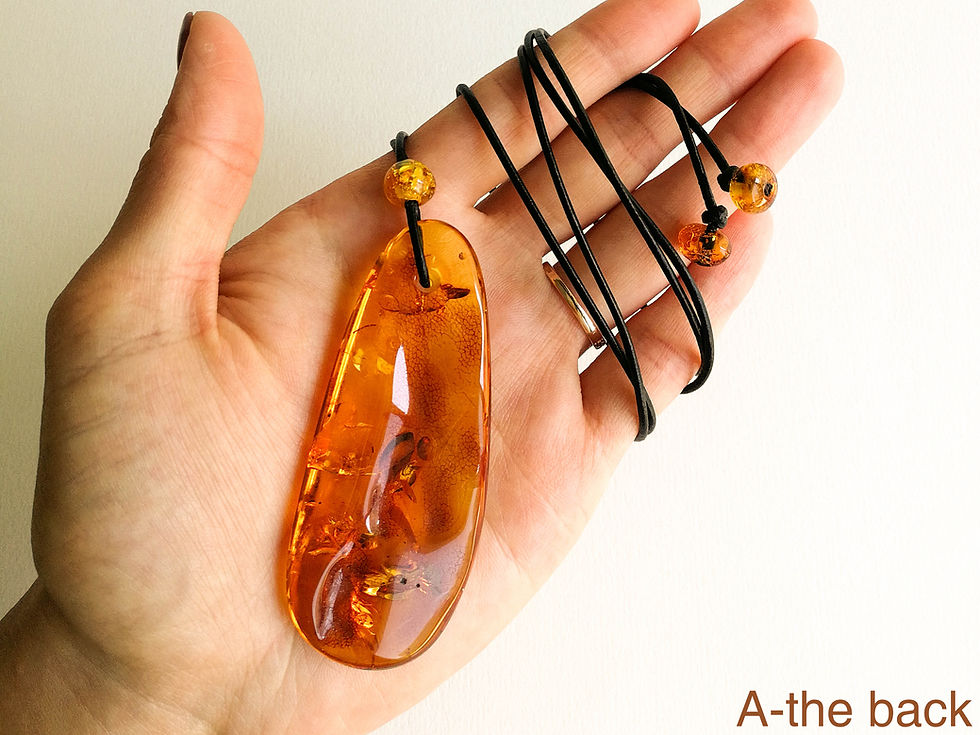 Thumbnail: Cognac color natural amber flat drop shape pendant with genuine leather strand