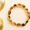 Thumbnail: Almond shape green color amber beads elastic everyday bracelet