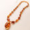 Thumbnail: Natural amber bright cognac color shiny oval pendant necklace