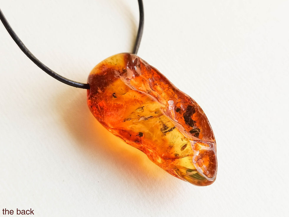 Thumbnail: Genuine amber cognac color tusk shape pendant on leather strand