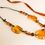 Thumbnail: Light cognac color natural amber necklace with cotton thread