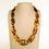 Thumbnail: Flat long oval beads natural Colombian copal necklace