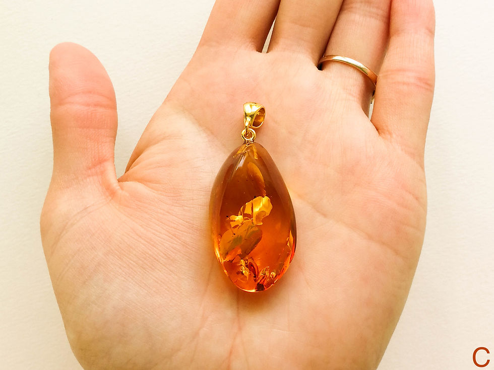 Thumbnail: Natural Baltic amber cognac color twisted oval shape pendant