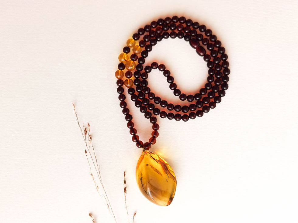 Thumbnail: Cherry color natural amber necklace with a lemon twisted drop pendant