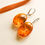 Thumbnail: Large size intense honey color oval shape amber earrings